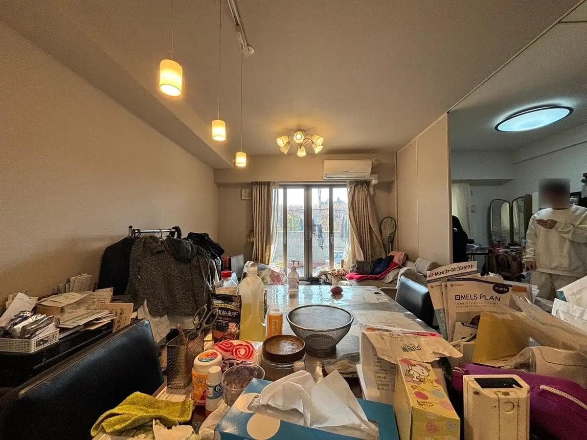 Cluttered real estate photo before AI cleanup